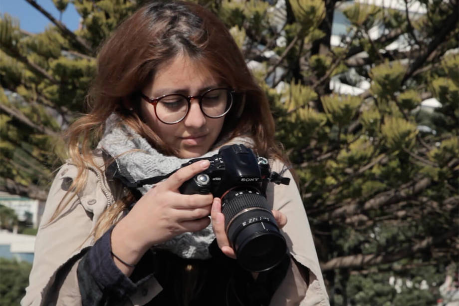 Victoria, an international photography student Victoria, an international student from Ecuador, with camera