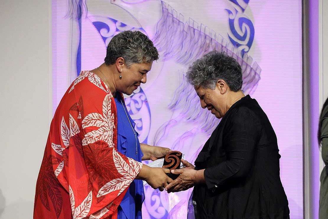 Professor Te Waru-Rewiri accepting the ‘Te Tohu o Te Papa Tongarewa Rongomaraeroa Award for outstanding contribution to Ngā Toi Māori’ from Deputy Chair of the Arts Council, Caren Rangi. Photo by Andrew Warner and supplied by Creative New Zealand.